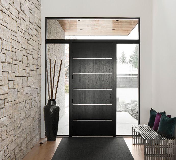 Modern black entry door with sidelites in a contemporary home