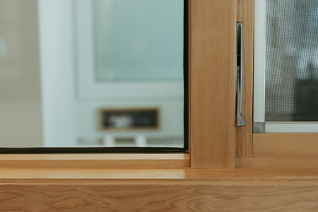 Modern wood interior jamb profile on a Genesis wood-clad window
